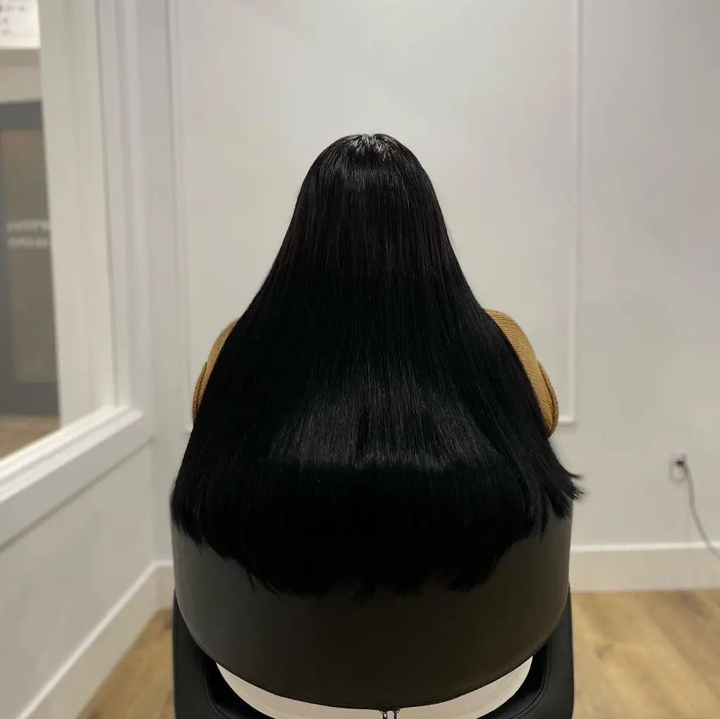 Home 6 A woman before and after getting black hair extensions, showing a dramatic change in her hairstyle.