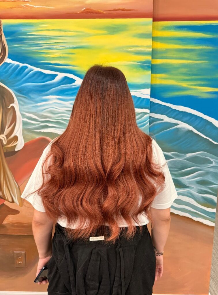 I-Tip Hair Extensions 5 Woman showcasing long, voluminous, and shiny hair after hair extensions installation.