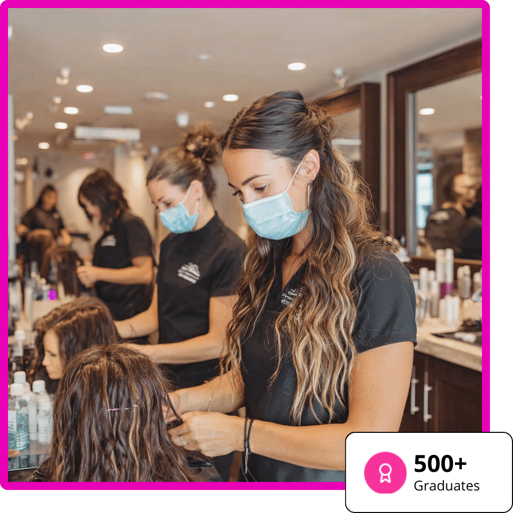 Hair Extensions Academy 3 Young adults in their 20s-30s focused on learning techniques in a modern, warm-toned Hair Extension Academy environment.